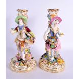 19th century pair of Minton figures of a boy and girl standing before a candlestick, the bases encru