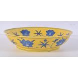 A Chinese porcelain Imperial yellow bowl decorated with flowers 19.5 cm.