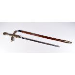 A contemporary brass handled sword with scabbard embossed with 3 Lions 103 cm.