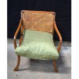 A low back oak Bergere chair with upholstered 67 x 58 x 66 cm