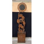 A continental wooden stick stand and sun flower clock 205 cm .