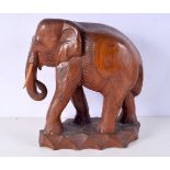 A large carved wooden Elephant 29 x 32 cm.