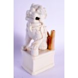 A 19TH CENTURY CHINESE BLANC DE CHINE PORCELAIN JOSS STICK HOLDER depicting a buddhistic lion. 14 cm