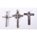 THREE WHITE METAL CRUCIFIXES OF VARIOUS FORMS. Largest 9.5cm x 5.6cm, total weight 93.1g