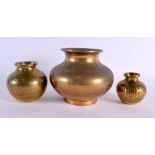 THREE 19TH CENTURY INDIAN BRONZE WATER POTS two with engraved decoration. Largest 15 cm wide. (3)