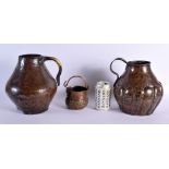 A 17TH/18TH CENTURY MIDDLE EASTERN ISLAMIC COPPER ALLOY JUG together with another similar and a swin