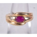 AN 14CT GOLD AND RUBY SNAKE RING. Stamped 14K, Size I, weight 5.5g