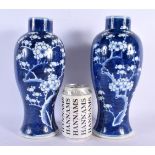 A PAIR OF 19TH CENTURY CHINESE BLUE AND WHITE VASES Kangxi style, painted with birds in flight. 27 c