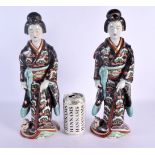 A LARGE PAIR OF 19TH CENTURY JAPANESE MEIJI PERIOD IMARI FIGURES modelled in robes beside cats. 36 c