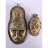 TWO TRIBAL BRONZE MASKS. 21 cm x 10.5 cm. (2)