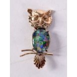 A GOLD AND OPAL OWL BROOCH. 4.1 grams. 4 cm x 2 cm.