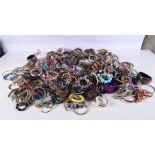 A huge collection of costume jewellery/bangles. (Qty)