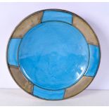 A middle Eastern pottery bowl, blue glaze with metal decoration.9 x 35 cm.