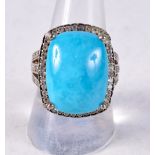 A SILVER AND TURQUOISE RING. 9.4 grams. Q.