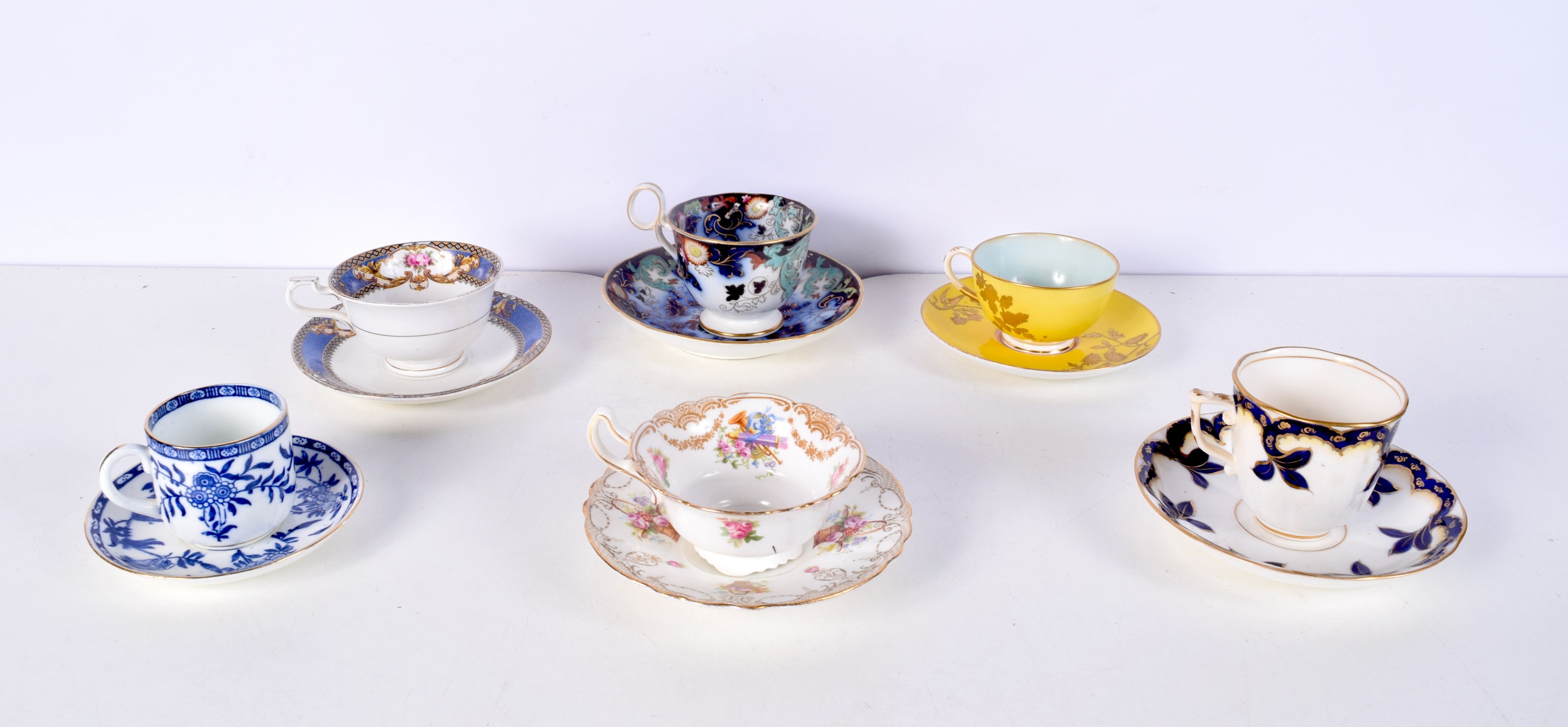 A collection of English ceramic tea cups and saucers, Doulton etc. (12)