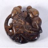 A CHINESE HARDSTONE EROTIC ROUNDEL 20th Century. 5.5 cm wide.