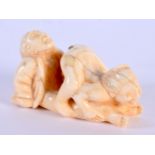 A JAPANESE CARVED BONE EROTIC NETSUKE. 5.5 cm x 2.5 cm.