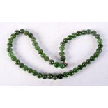 A CHINESE JADE NECKLACE. 41 cm long.