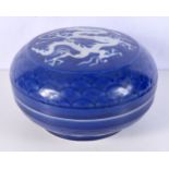 A large Chinese porcelain sacrificial blue lidded pot decorated in relief with a dragon 14 x 25 cm.