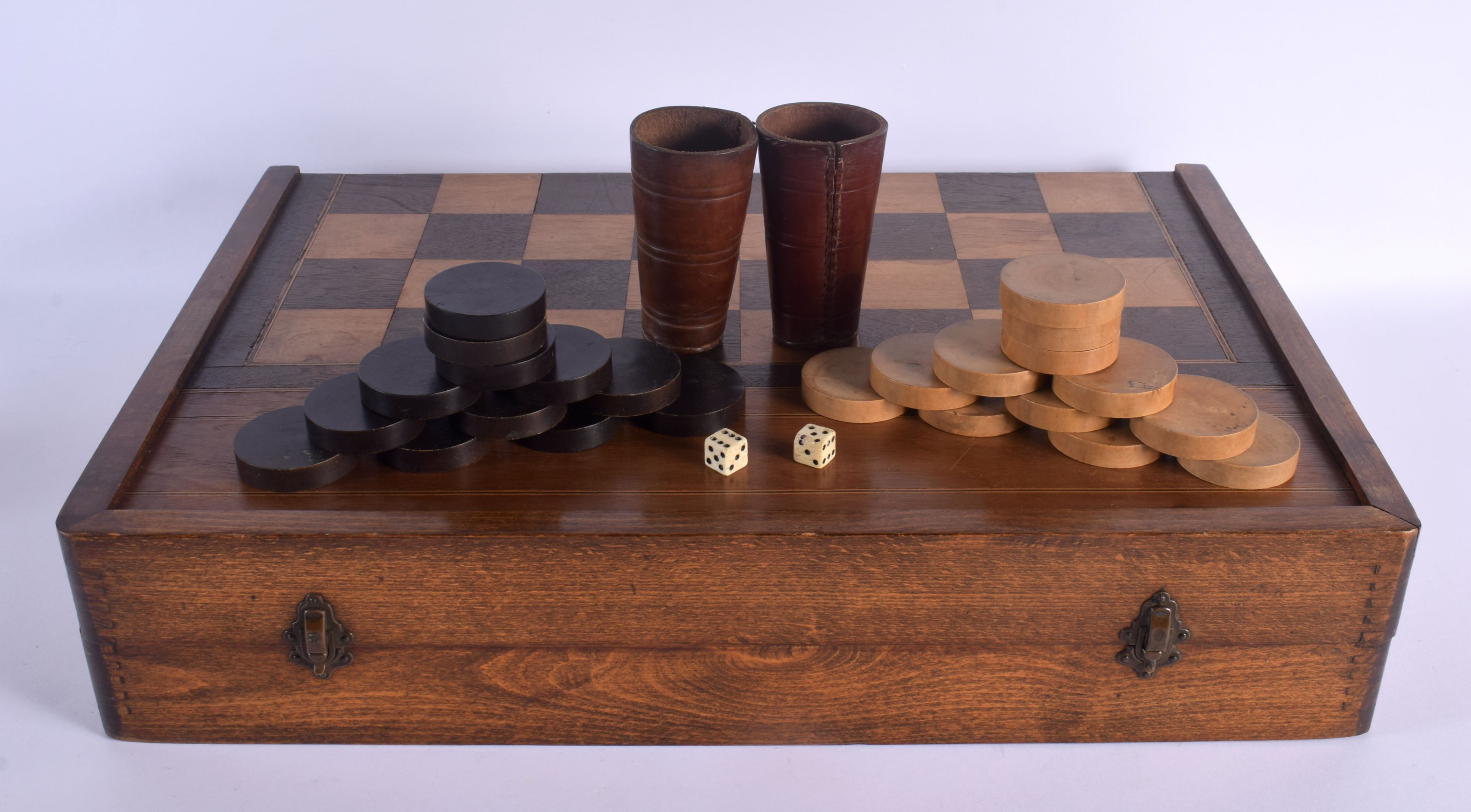 AN ANTIQUE BACKGAMMON AND DRAUGHTS FOLDING GAMING BOARD. 56 cm x 70 cm open.