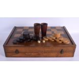 AN ANTIQUE BACKGAMMON AND DRAUGHTS FOLDING GAMING BOARD. 56 cm x 70 cm open.