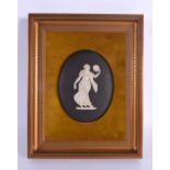 A FRAMED WEDGWOOD BLACK BASALT CLASSICAL PLAQUE. 24 cm x 12 cm.