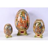 A collection of Mid Century Porcelain Eggs decorated with Japanese style decoration largest 30 cm (3