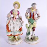 A PAIR OF GERMAN PORCELAIN FIGURES. 23 cm high.