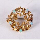 A VINTAGE YELLOW METAL AND OPAL BROOCH. 2 grams. 1.5 cm wide.