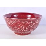 A Chinese porcelain iron red glazed bowl decorated in relief with Dragon and phoenix 10 x 20 cm.