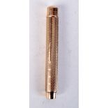 A 9CT GOLD PENCIL HOLDER BY SAMPSON MORDAN & CO. Stamped 375, 8cm x 1cm, total weight incl pencil 2