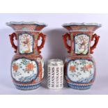 A PAIR OF 19TH CENTURY JAPANESE MEIJI PERIOD TWIN HANDLED IMARI VASE painted with foliage. 26 cm x 1
