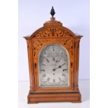 A carved wooden cased bracket clock by Crouch of Clapham & Brixton 63 x 36 x 22 cm.