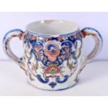 A 19th Century French porcelain loving cup 11 x 19 cm .