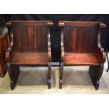 A PAIR OF EARLY 20TH CENTURY CHURCH PEWS in the Arts and Crafts manner. 93 cm x 71 cm x 48 cm.