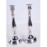 A PAIR OF SILVER CANDLESTICKS and a silver mounted box. Silver 227 grams. Largest 25 cm x 10 cm. (3)