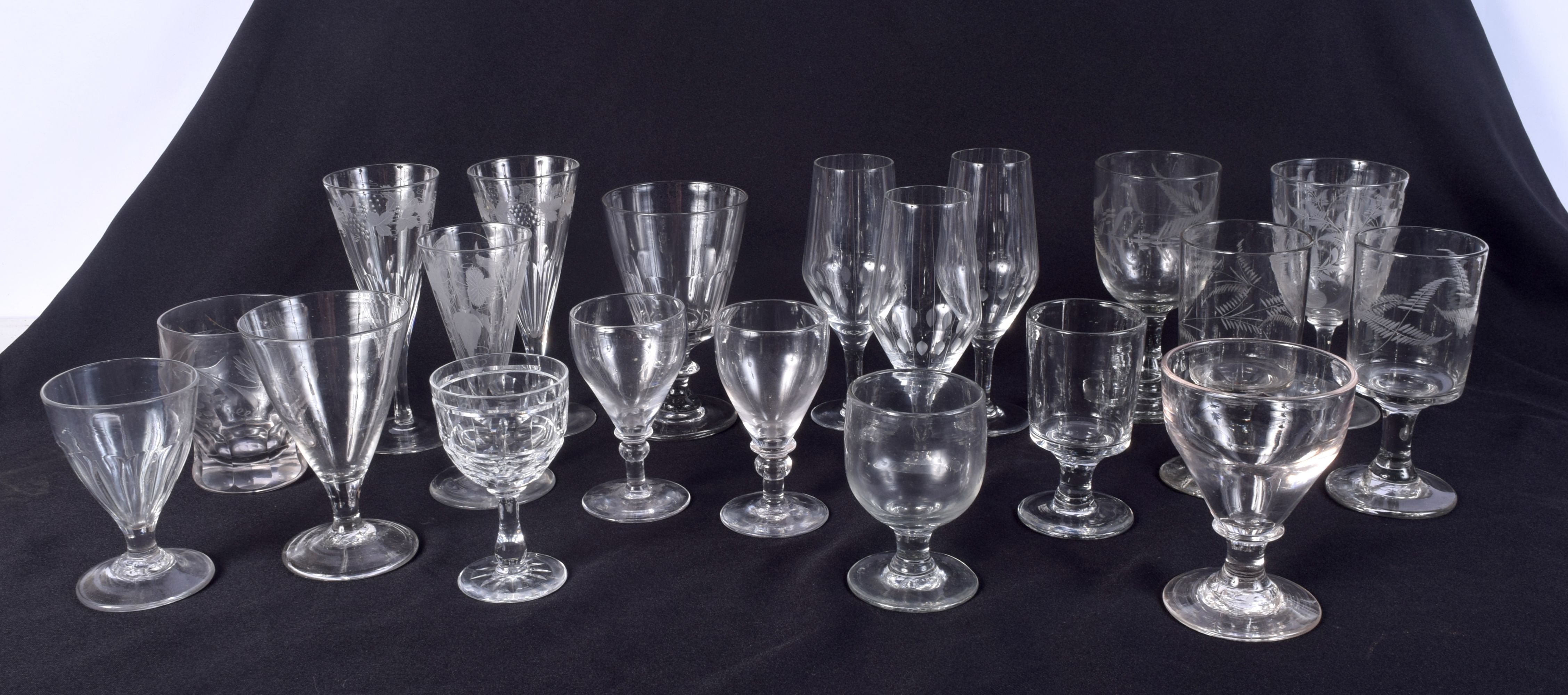 A collection of etched glassware together with other glasses ;largest 19 cm (19).