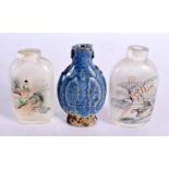 A LATE 19TH CENTURY CHINESE BLUE GLAZED SNUFF BOTTLE together with another. Largest 7 cm x 4 cm. (3)