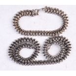 A SILVER NECKLACE and bracelet. 50 grams. Largest 41 cm long. (2)