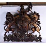 A LARGE ANTIQUE COUNTRY HOUSE ARMORIAL CARVED WOOD COAT OF ARMS. 80 cm x 75 cm.