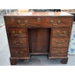 A GOOD GEORGE III KNEEHOLE DESK with one long and six small drawers. 80 cm x 92 cm x 46 cm.