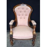 A VICTORIAN UPHOLSTERED CHAIR. 95 cm x 60 cm.