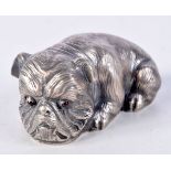 A CONTINENTAL SILVER DOG WITH GEM SET EYES. Stamped 88, 3.2cm x 6.5cm x 3.6cm, weight 60.3g