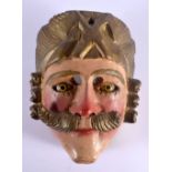 AN EARLY CONTINENTAL FOLK ART POLYCHROMED WOOD MASK. 21 cm x 14 cm.