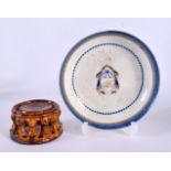 A CHINESE TREACLE GLAZED STAND 20th Century, and a Qianlong saucer. Largest 8 cm diameter. (2)