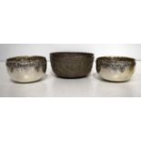 THREE MIDDLE EASTERN WHITE METAL BOWLS. 262 grams. Largest