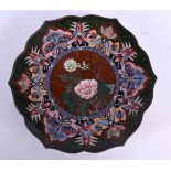 A LATE 19TH CENTURY JAPANESE MEIJI PERIOD CLOISONNE ENAMEL DISH decorated with foliage. 22 cm wide.