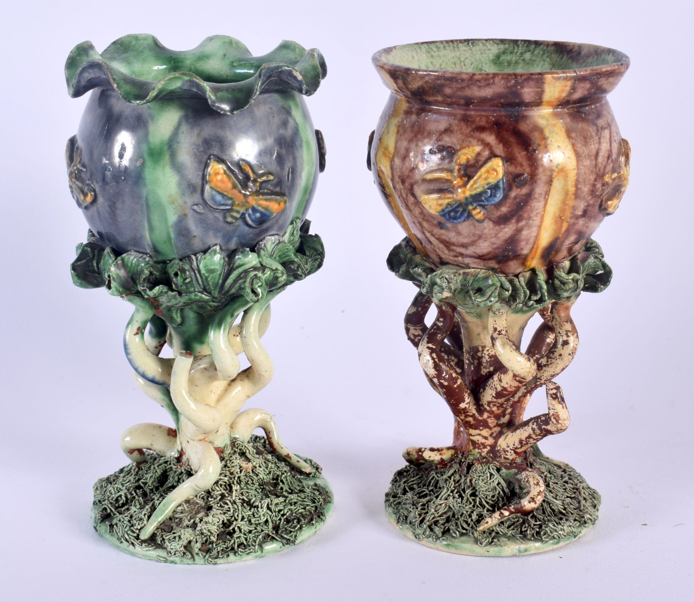 A RARE PAIR OF ANTIQUE PORTUGUESE MAFFA MINIATURE MAJOLICA PLANTERS of naturalistic form. 13.5 cm hi