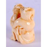 A JAPANESE CARVED BONE EROTIC NETSUKE. 4.5 cm x 3.5 cm.