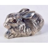 A CONTINENTAL SILVER RABBIT WITH GEM SET EYES. Stamped 88, 3.7cm x 7cm x 4cm, weight 63.1g